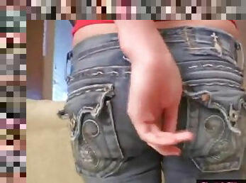 Naughty teen takes off her jeans to show her ass