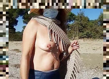 Nipple ring lover walking topless on a public beach - pierced boobs big nipples with nipple chain - flashing pierced pussy