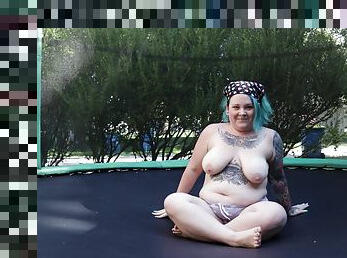 Fat Tattooed Milf Jumping and Stripping on a Trampoline