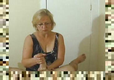 Mature with skills gives POV handjob