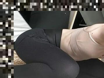 barefoot stretching in tight leggings