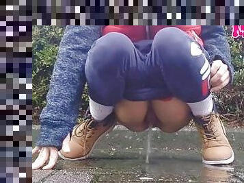 Amateur girl pees in the street
