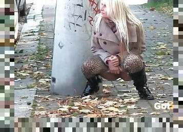 Leopard print leggings and boots on a pissing girl