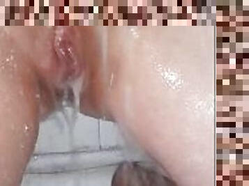 Housewife washes her pussy in the shower
