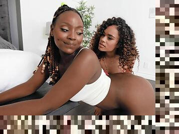 Smashing ebony dolls lick one another's fresh pussy in fabulous home duo