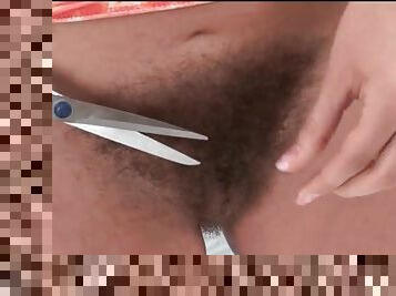 Redhead cuts her pubic hair with scissors