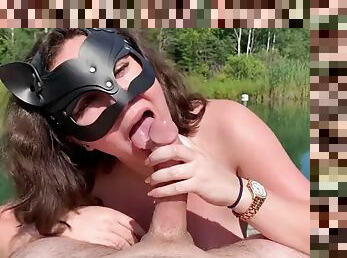 Busty wife sucks her husband by the lake