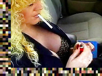 Slutty milf smokes while posing