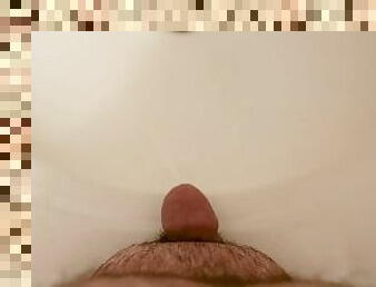 Close up of small dick while peeing into bathroom sink.