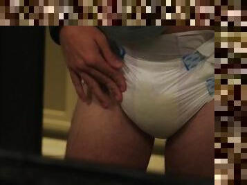 Diaper soaking in posh hotel bathroom (pee squishing too)