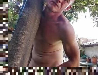 I jerk off in the garden leaning against a tree 2