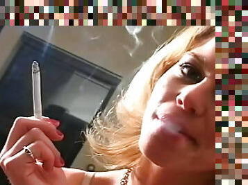 Sexy blonde masturbates and smokes