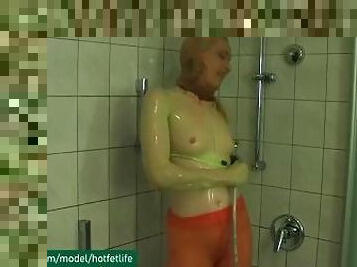 Me in wet nylon encasement tights under shower