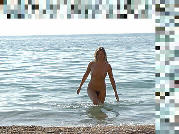 Hairy girl Riana S makes a splash at the beach