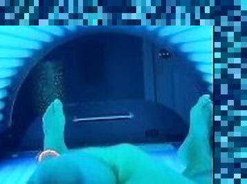 Spanking it in the tanning bed