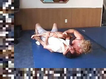 CatFight mixed wrestling beatdown-female bodybuilder Kathy Conners dominates with scissors, as