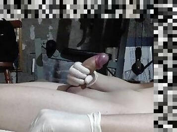 Femboy masturbates with gloves and cums