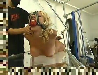 Amazing blondie is under an amazing bondage