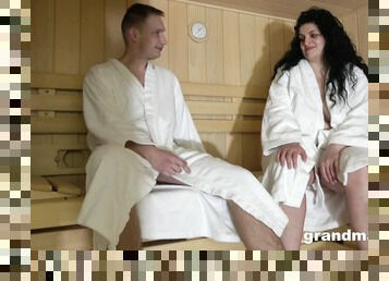 Chubby old woman is dating handsome young guy in the sauna