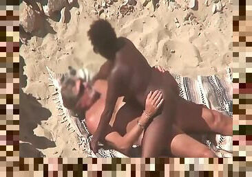 Interracial couple caught fucking on the beach