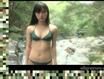 Cute Japanese teen poses solo in bikini outdoors