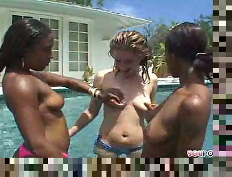 Two ebony sweeties and their white girlfriend eating out wet pussies each other in a swimming pool